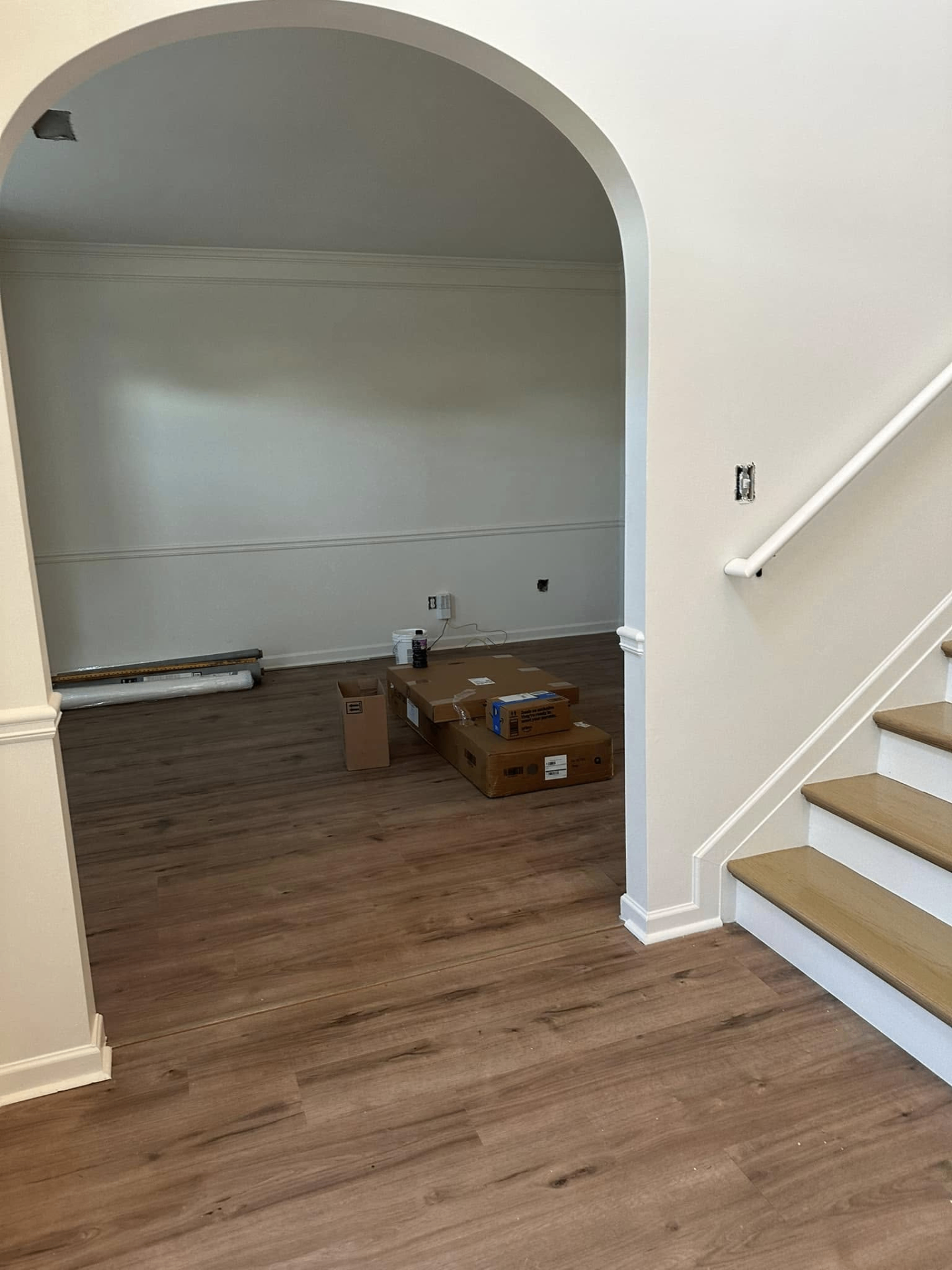 Archway and entry with fresh paint and new flooring