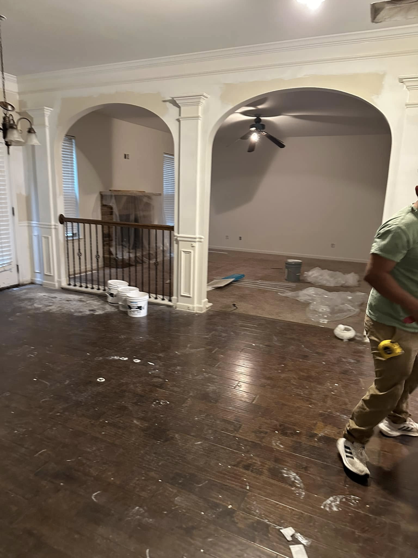 Open living area mid-remodel with hardwood floors