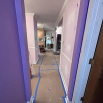 Hallway with fresh purple accent paint in progress
