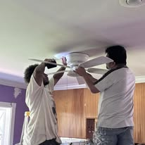 Crew installing a new ceiling fan